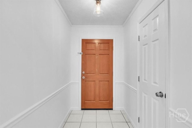 237 Robinson Loop, Richmond Hill, GA 31324 - entryway featuring light tile patterned floors, ornamental molding, and a textured ceiling