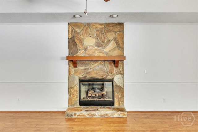 237 Robinson Loop, Richmond Hill, GA 31324 - detailed view of wood finished floors and a stone fireplace