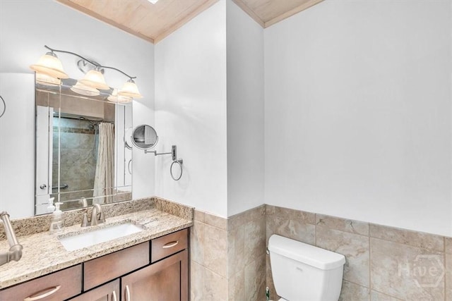 237 Robinson Loop, Richmond Hill, GA 31324 - full bath with vanity, ornamental molding, wainscoting, a tile shower, and tile walls