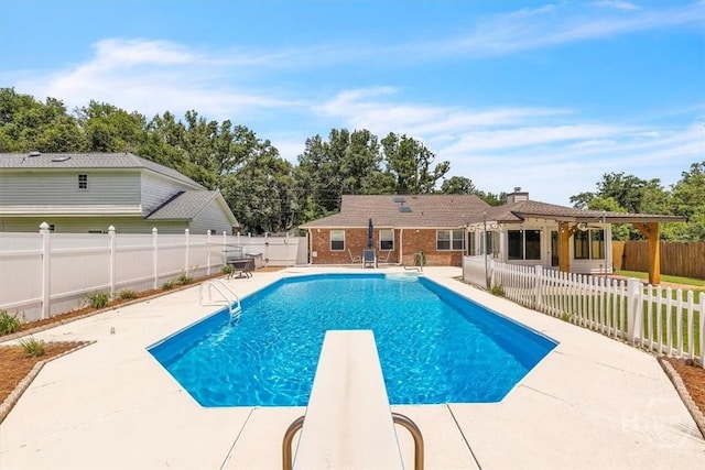 237 Robinson Loop, Richmond Hill, GA 31324 - view of pool featuring a patio area, a fenced backyard, and a diving board