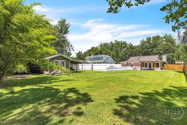 237 Robinson Loop, Richmond Hill, GA 31324 - fenced backyard featuring a storage unit