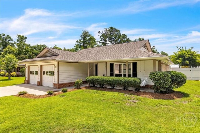 237 Robinson Loop, Richmond Hill, GA 31324 - ranch-style home featuring brick siding, an attached garage, concrete driveway, and a shingled roof