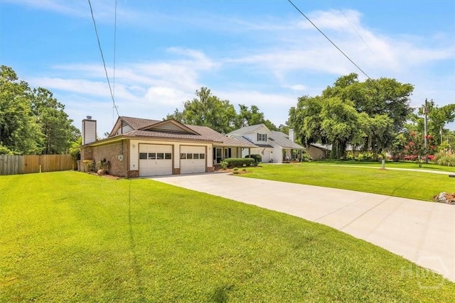 237 Robinson Loop, Richmond Hill, GA 31324 - view of front facade featuring an attached garage, concrete driveway, and a chimney
