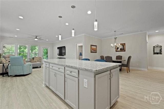 137 Harvest Hl, Pooler, GA 31322 - kitchen featuring crown molding, open floor plan, light wood finished floors, recessed lighting, and a kitchen island