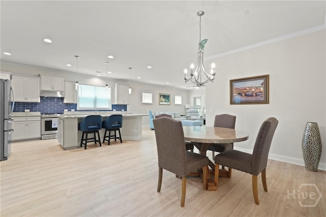 137 Harvest Hl, Pooler, GA 31322 - dining room with a chandelier, recessed lighting, crown molding, and light wood-style flooring