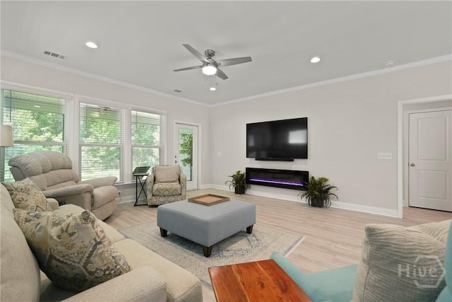 137 Harvest Hl, Pooler, GA 31322 - living room featuring a ceiling fan, light wood-type flooring, recessed lighting, crown molding, and a glass covered fireplace