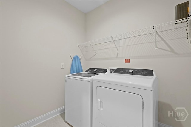 137 Harvest Hl, Pooler, GA 31322 - laundry room with washing machine and clothes dryer and light tile patterned floors