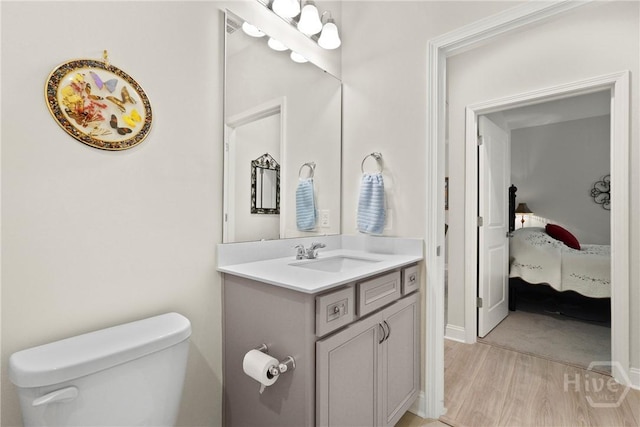 137 Harvest Hl, Pooler, GA 31322 - bathroom featuring vanity, wood finished floors, and ensuite bath