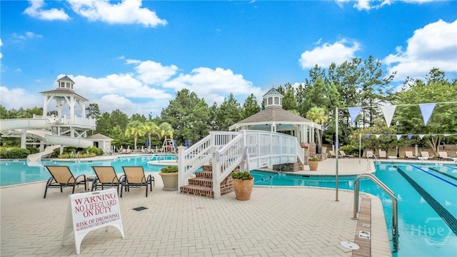 137 Harvest Hl, Pooler, GA 31322 - community pool featuring a water slide, a gazebo, a patio area, and view of scattered trees