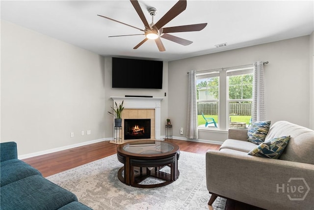 9 Melody Dr, Pooler, GA 31322 - living area featuring ceiling fan, wood finished floors, and a tiled fireplace