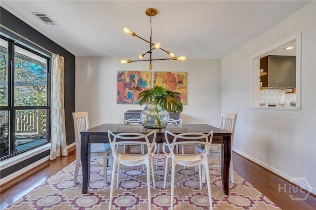 102 Phyllis Dr, Savannah, GA 31419 - dining area with a chandelier and wood finished floors