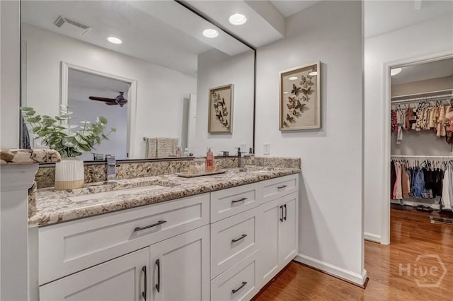 102 Phyllis Dr, Savannah, GA 31419 - full bathroom featuring double vanity, wood finished floors, and a spacious closet