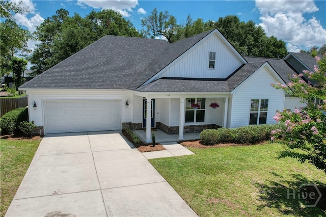 110 Tailwind Trl, Guyton, GA 31312 - view of front facade with a garage, roof with shingles, concrete driveway, a porch, and stone siding