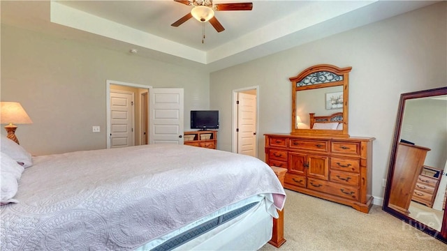 110 Tailwind Trl, Guyton, GA 31312 - bedroom featuring light carpet, a ceiling fan, and a tray ceiling