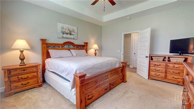 110 Tailwind Trl, Guyton, GA 31312 - bedroom with light colored carpet, a ceiling fan, and a tray ceiling
