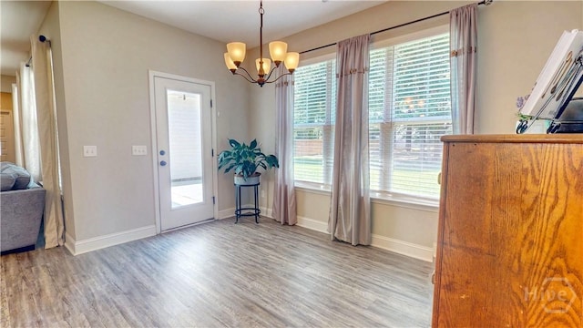 110 Tailwind Trl, Guyton, GA 31312 - dining area with wood finished floors and a chandelier
