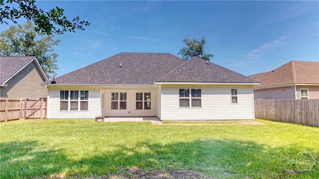 110 Tailwind Trl, Guyton, GA 31312 - back of property featuring a fenced backyard, a shingled roof, and a patio