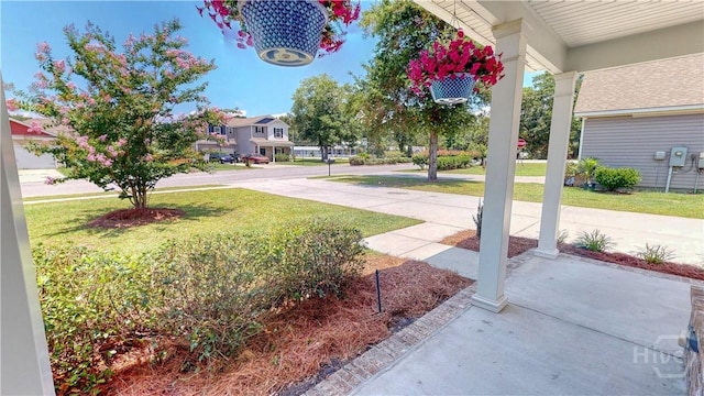 110 Tailwind Trl, Guyton, GA 31312 - view of grassy yard featuring a porch and a residential view