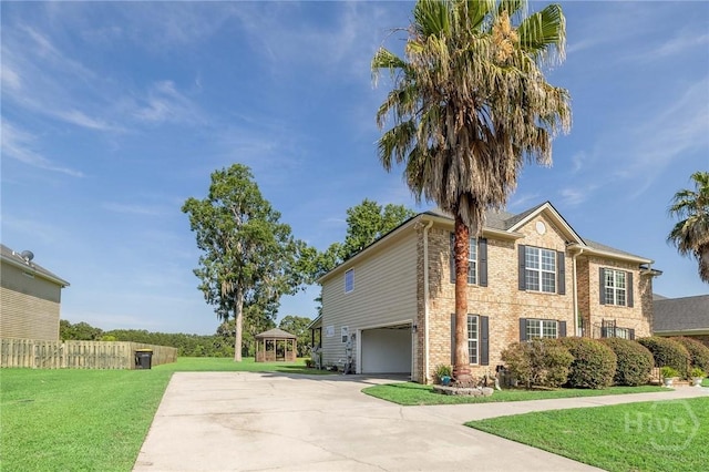 9 Sweetwater Ct, Savannah, GA 31419 - view of side of home with an attached garage, driveway, and brick siding