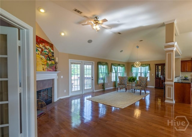 9 Sweetwater Ct, Savannah, GA 31419 - living room featuring a ceiling fan, lofted ceiling, healthy amount of natural light, a glass covered fireplace, and wood finished floors