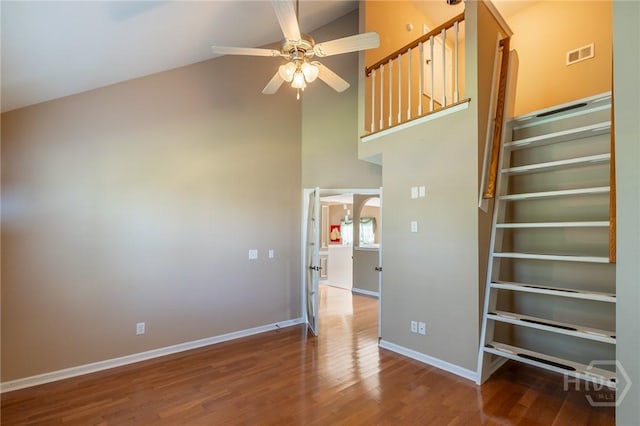 9 Sweetwater Ct, Savannah, GA 31419 - stairway with high vaulted ceiling, a ceiling fan, wood finished floors, and arched walkways