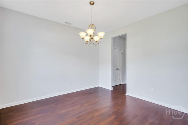 89 NE Morgan Field Blvd, Ludowici, GA 31316 - unfurnished room featuring a chandelier and wood finished floors