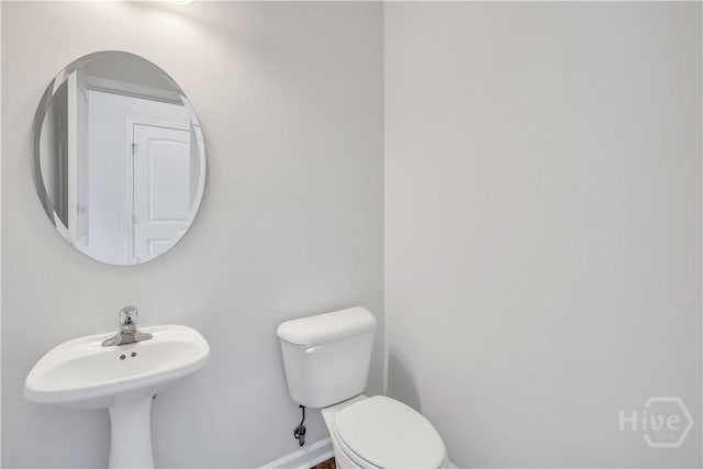 89 NE Morgan Field Blvd, Ludowici, GA 31316 - bathroom with baseboards and toilet