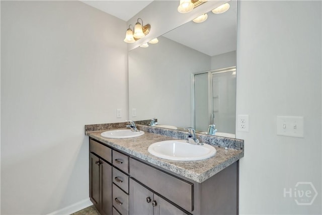 89 NE Morgan Field Blvd, Ludowici, GA 31316 - bathroom featuring double vanity and a shower with door