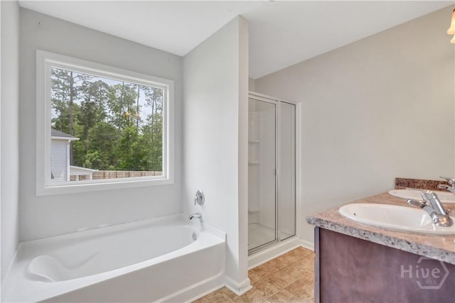 89 NE Morgan Field Blvd, Ludowici, GA 31316 - full bath featuring a bath, a stall shower, double vanity, and tile patterned floors
