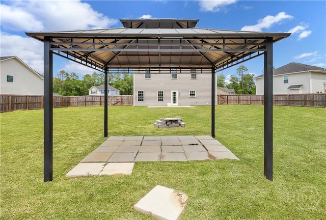 89 NE Morgan Field Blvd, Ludowici, GA 31316 - fenced backyard with a gazebo and a patio area