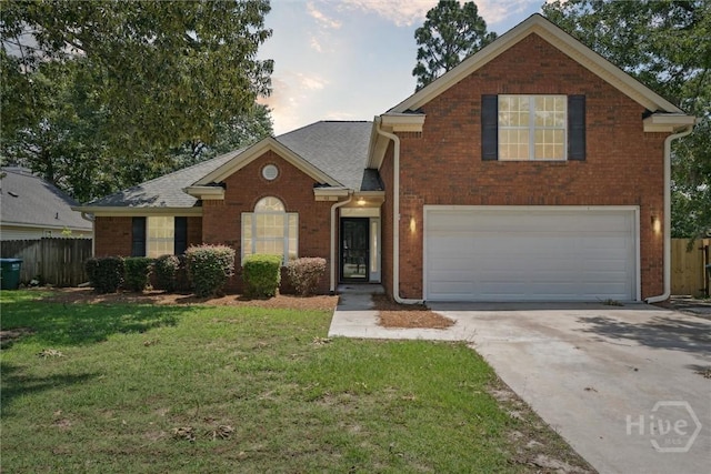 413 Roberts Way, Rincon, GA 31326 - traditional home with an attached garage, driveway, and brick siding