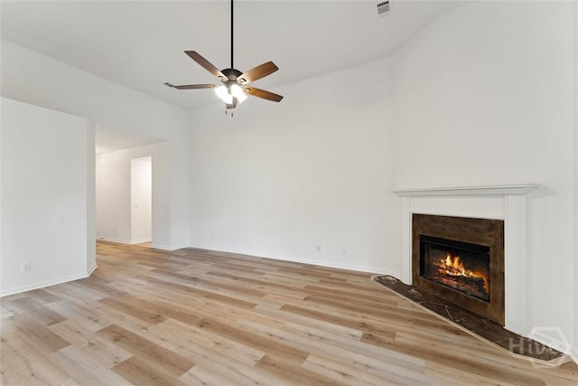 413 Roberts Way, Rincon, GA 31326 - unfurnished living room featuring a premium fireplace, a ceiling fan, light wood finished floors, and high vaulted ceiling