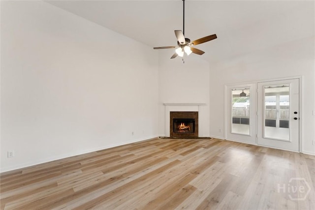 413 Roberts Way, Rincon, GA 31326 - unfurnished living room with ceiling fan, light wood-type flooring, a fireplace with flush hearth, and high vaulted ceiling
