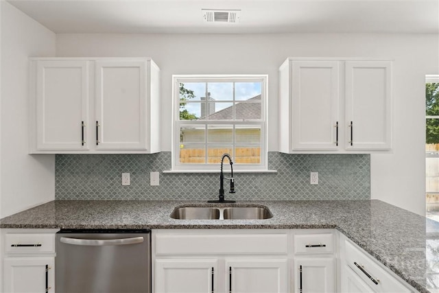 413 Roberts Way, Rincon, GA 31326 - kitchen featuring stainless steel dishwasher, white cabinets, decorative backsplash, and light stone countertops