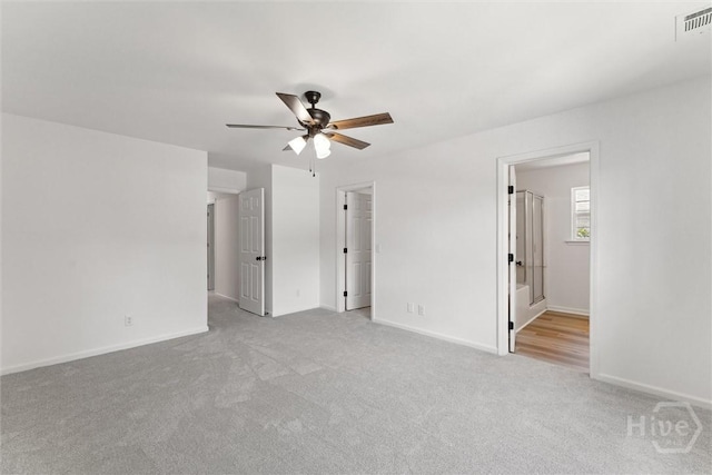 413 Roberts Way, Rincon, GA 31326 - unfurnished bedroom featuring carpet floors, a ceiling fan, and ensuite bathroom