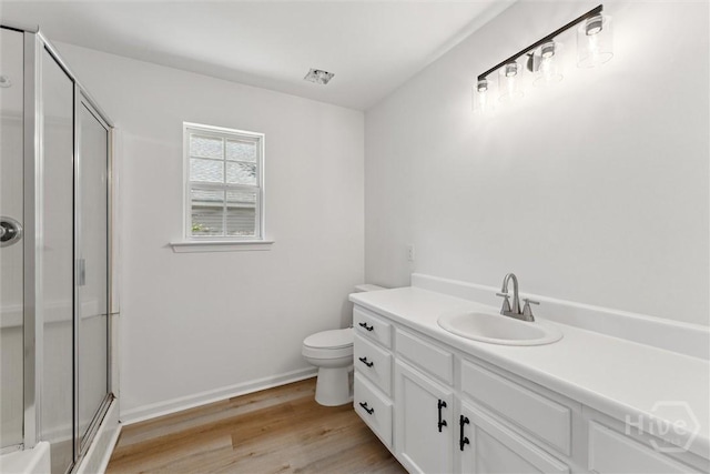 413 Roberts Way, Rincon, GA 31326 - full bath featuring a shower with shower door, vanity, and wood finished floors