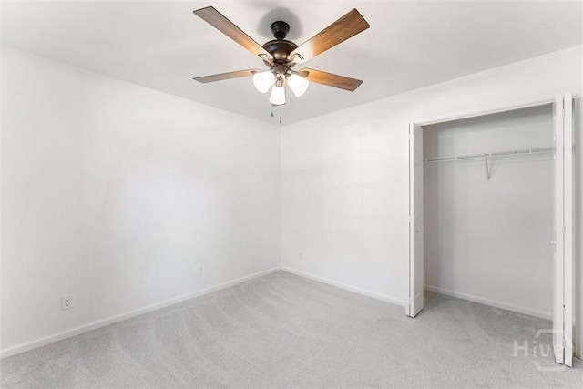 413 Roberts Way, Rincon, GA 31326 - unfurnished bedroom featuring light colored carpet, a closet, and a ceiling fan