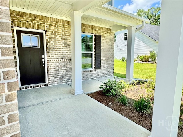 134 Melody Dr, Pooler, GA 31322 - doorway to property with covered porch and brick siding