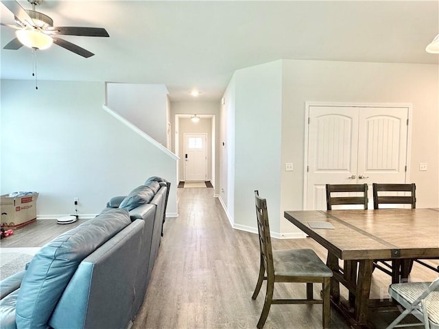 134 Melody Dr, Pooler, GA 31322 - dining space with light wood-style flooring, ceiling fan, and stairs