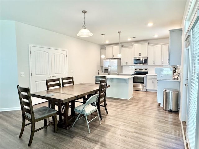 134 Melody Dr, Pooler, GA 31322 - dining space featuring light wood-type flooring and recessed lighting