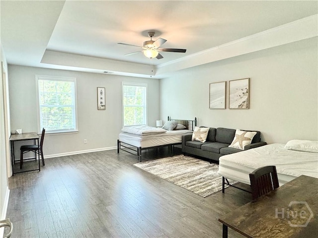 134 Melody Dr, Pooler, GA 31322 - living area featuring a raised ceiling, wood finished floors, and a ceiling fan