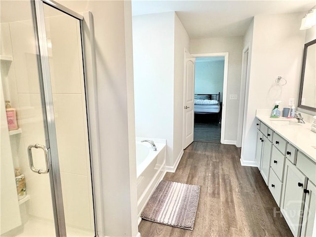 134 Melody Dr, Pooler, GA 31322 - ensuite bathroom with vanity, wood finished floors, a stall shower, and a garden tub