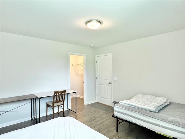 134 Melody Dr, Pooler, GA 31322 - bedroom featuring wood finished floors, a spacious closet, and a closet