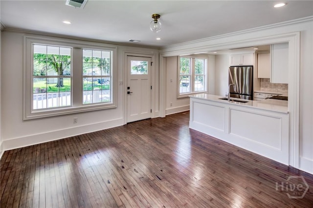 2125 Atlantic Ave, Savannah, GA 31401 - entrance foyer with crown molding, dark wood finished floors, and recessed lighting