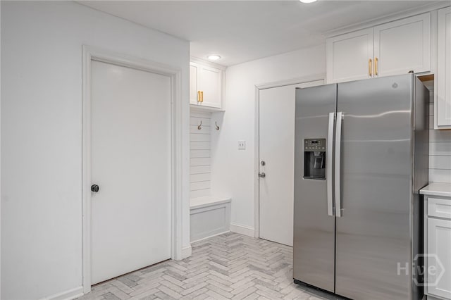 9 Bowline Ct, Savannah, GA 31411 - kitchen featuring stainless steel fridge with ice dispenser, white cabinetry, light countertops, and recessed lighting