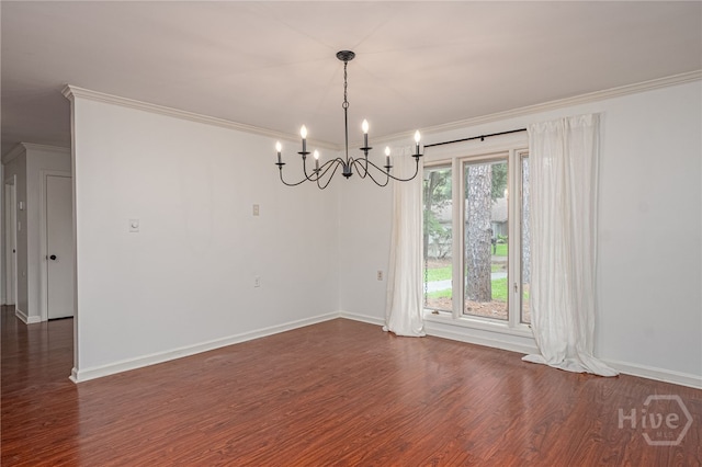 9 Bowline Ct, Savannah, GA 31411 - empty room featuring dark wood finished floors, a chandelier, and ornamental molding