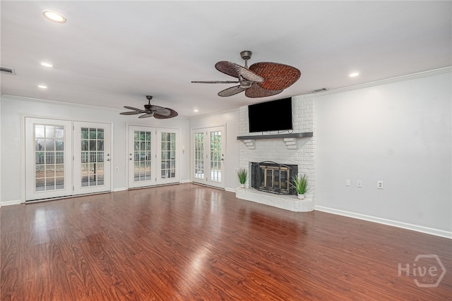 9 Bowline Ct, Savannah, GA 31411 - unfurnished living room with ceiling fan, recessed lighting, ornamental molding, a brick fireplace, and wood finished floors