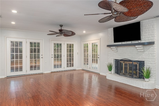 9 Bowline Ct, Savannah, GA 31411 - unfurnished living room featuring a ceiling fan, wood finished floors, ornamental molding, recessed lighting, and a brick fireplace