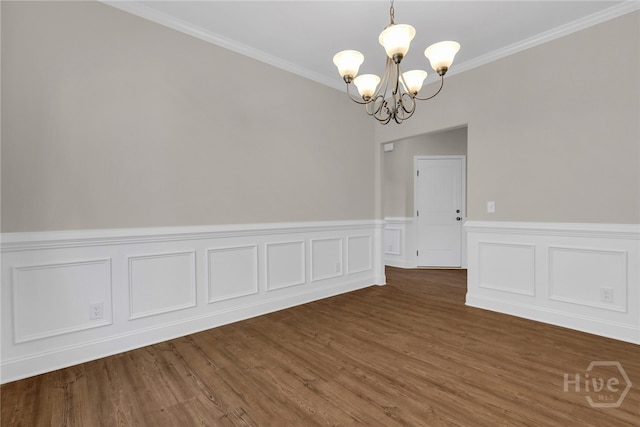 151 Guana Ln, Bloomingdale, GA 31302 - unfurnished room featuring a chandelier, wood finished floors, crown molding, and a wainscoted wall