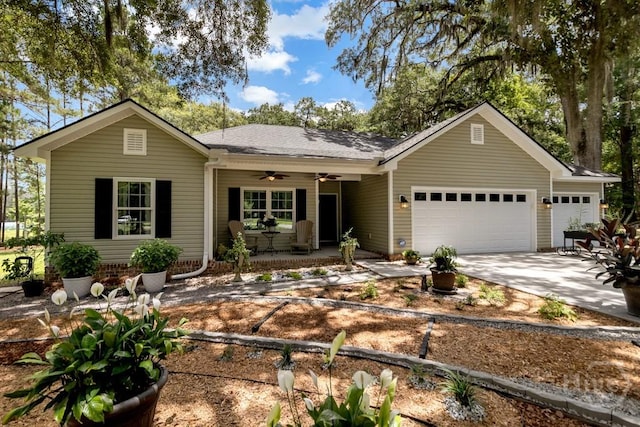 287 Sandpiper Rd, Midway, GA 31320 - ranch-style home with an attached garage, concrete driveway, ceiling fan, a porch, and a shingled roof